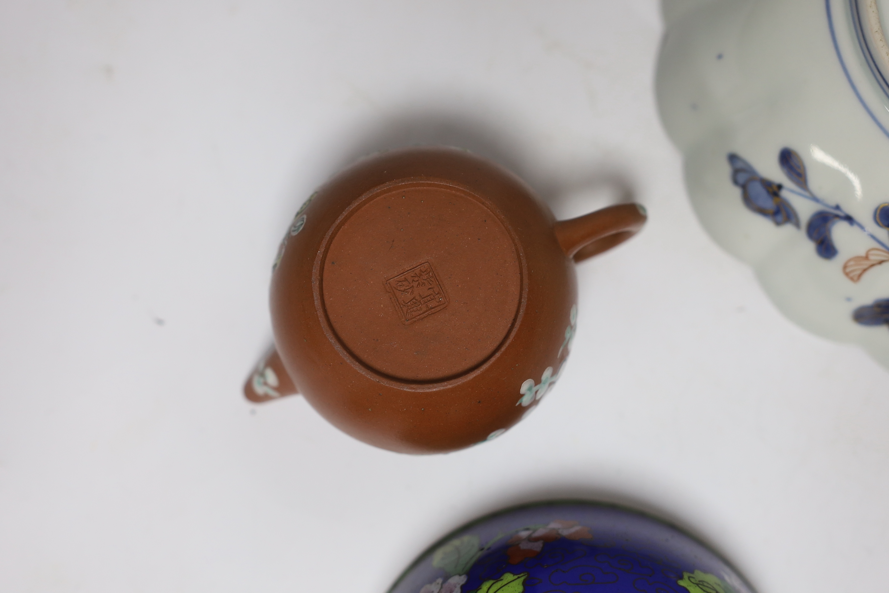 A Chinese enamelled yixing teapot and cloisonné bowl together with a Japanese Imari bowl and a Satsuma seated figure of a Buddhist monk, tallest 14cm